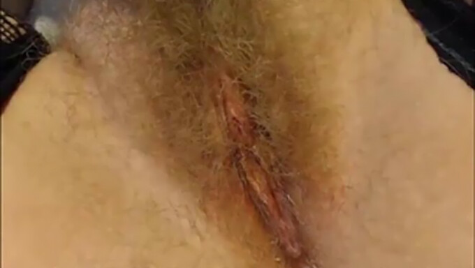 Amateur webcam closeup of hairy blonde's pussy