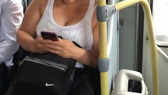 A Busty Milf Riding In A Bus