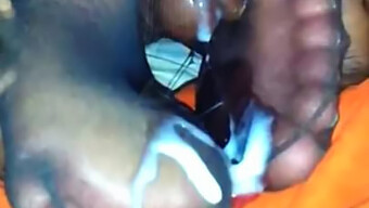 African-American footjob with a large ejaculation inside a nylon sheath