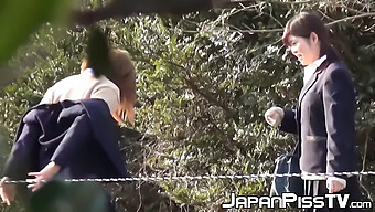 Japanese Schoolgirls Engage In Naughty Activities, Holding Each Other And Urinating Outdoors