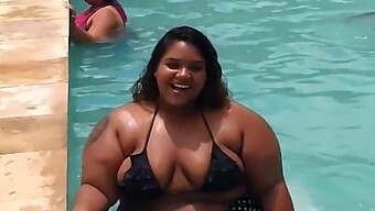 Voluptuous Black Woman With Large Breasts And A Big Ass Swims In A Pool